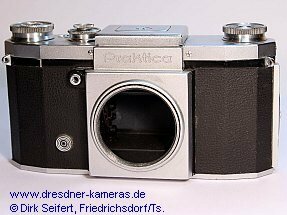 Praktica, nachger�stete Blitzsynchronisation 1 DIN-Buchse (Praktica, Versionen mit angegossenen Trage�sen und mit eingeschraubten Trage�sen) Importeur: Kine Camera Co. a Division of Ocean Photo Supply Co. Inc., 11 West 20th Street, New York 11, N.Y.