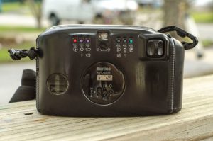 The back of the camera features the 6 mode buttons, the date imprint controls, the "joystick" and that really tiny viewfinder.