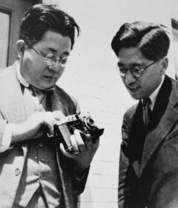 Seiichi Mamiya and Tsunejiro Sugawara showing off a Mamiya Six sometime around 1940.